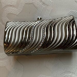 Small silver metal evening clutch